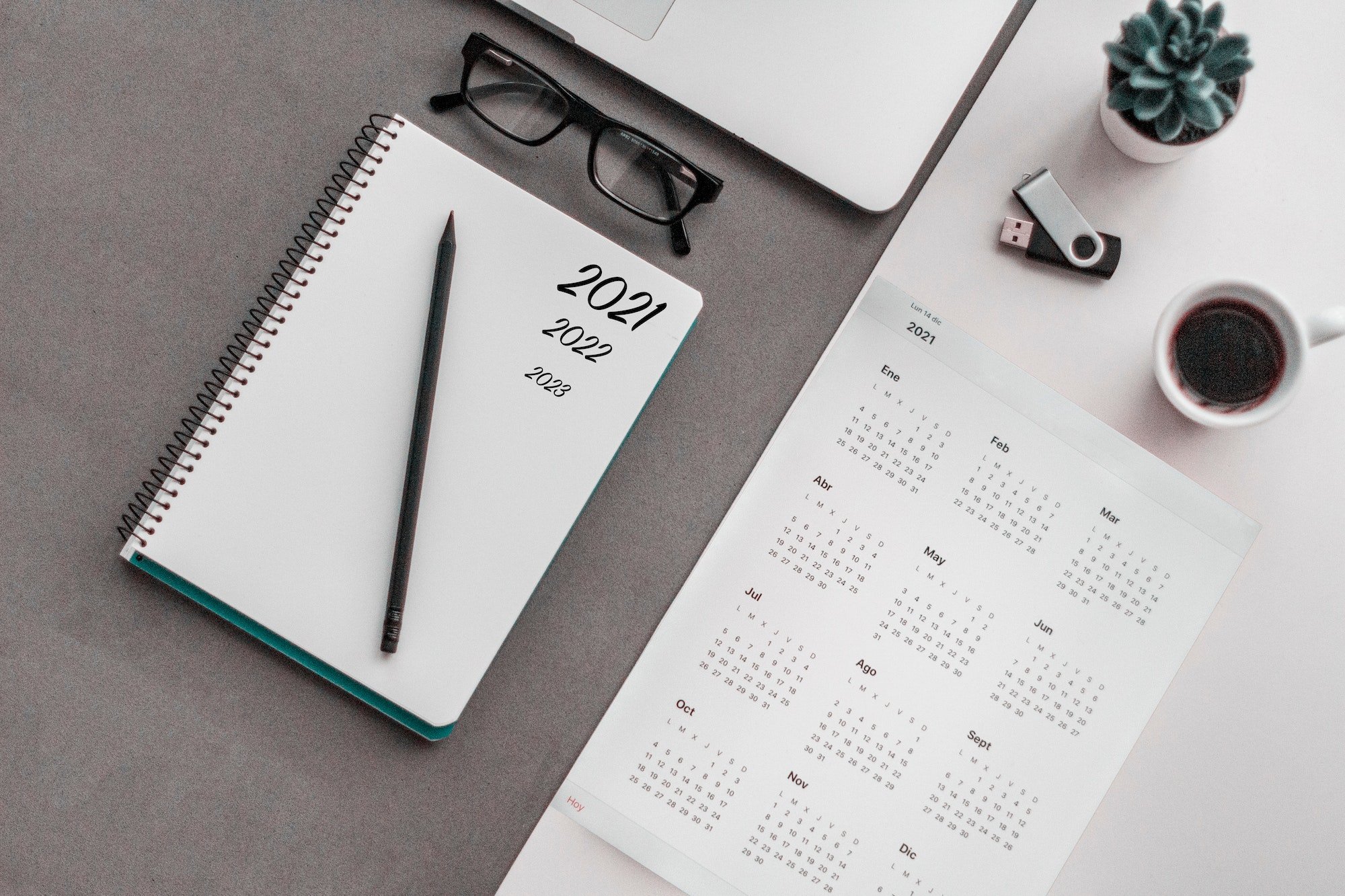 Calendar flat lay, scheduling, appointment, managing time, time, notebook, pencil, glasses,