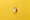 Top view of a metal padlock on a yellow background